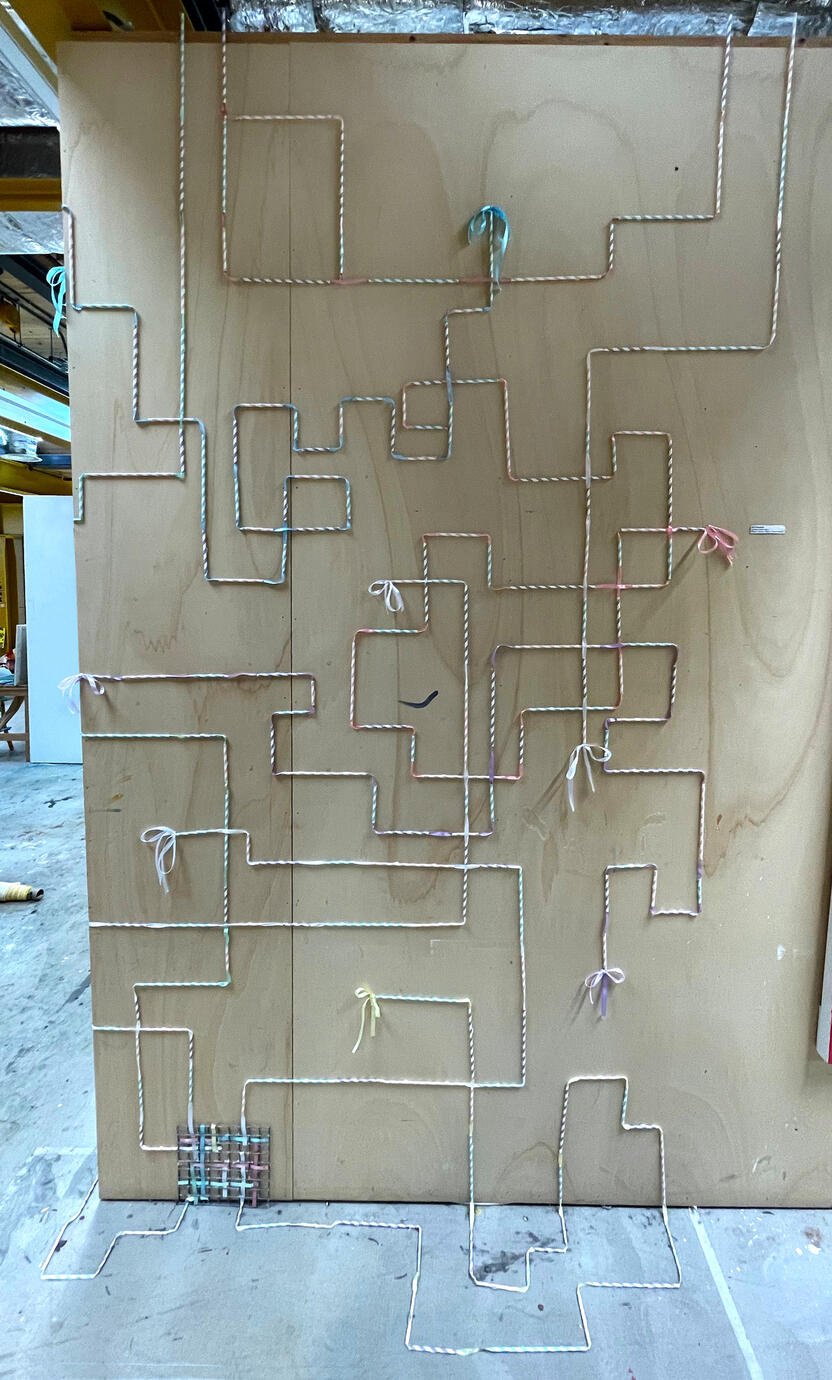untitled (wall pipes) [2025] Installation - paper straws, ribbon, found metal