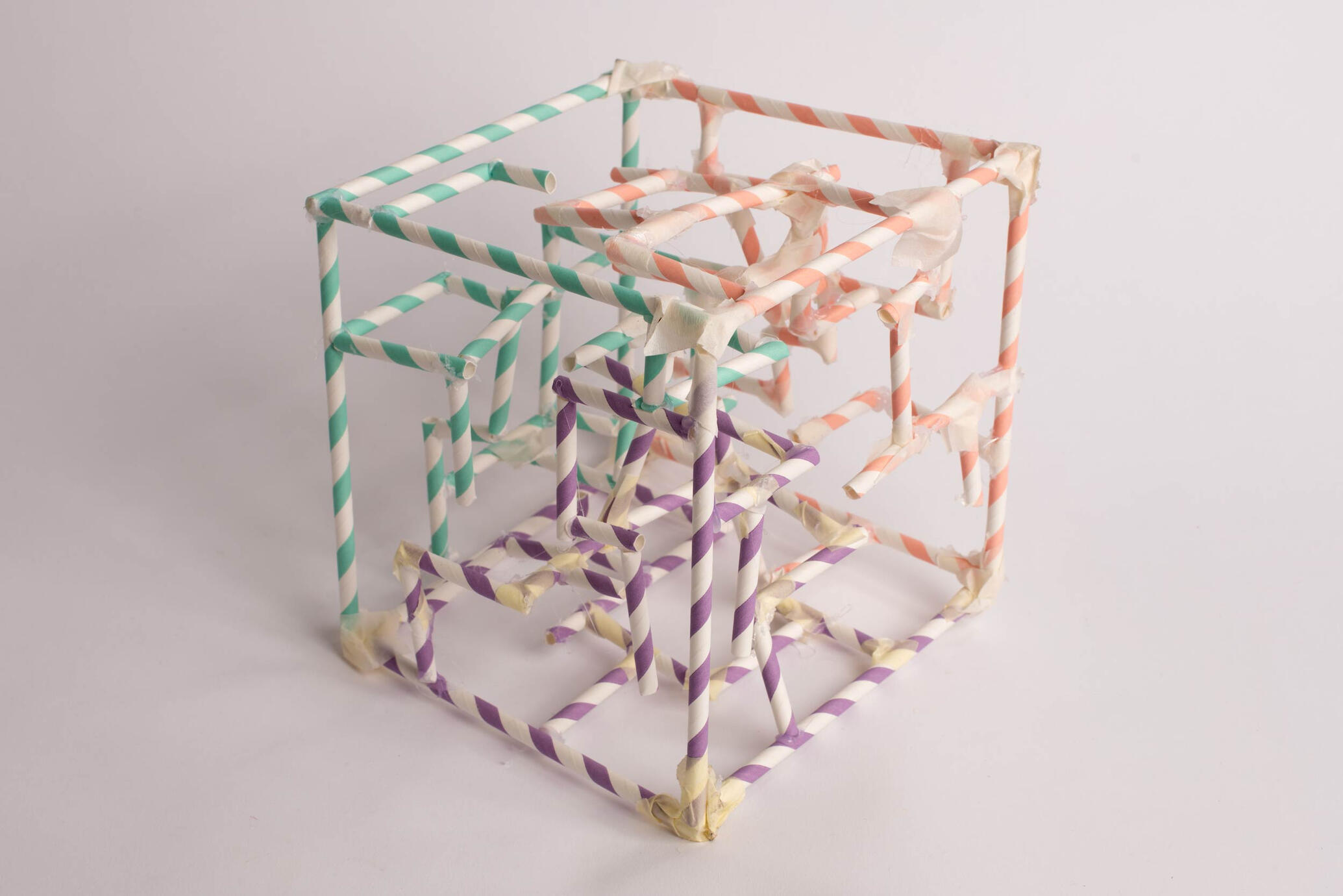 untitled (cube maquette) [2025] Paper straws, masking tape, glue